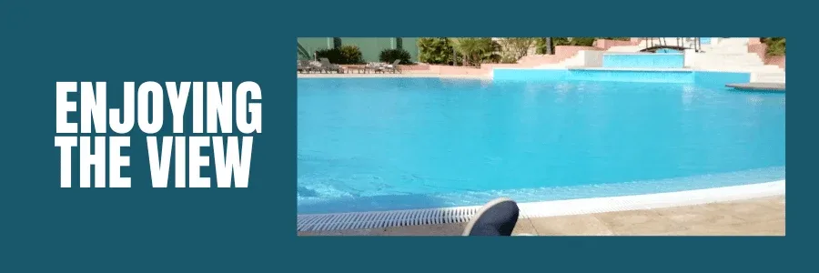 solo female holiday in vilamoura post picture showing my feet while sitting by the pool
