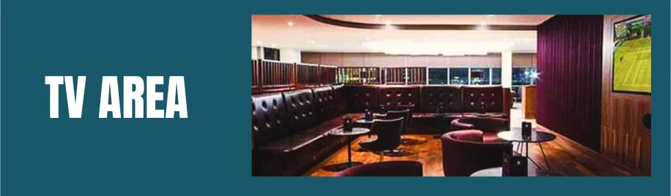 no1 lounge north terminal gatwick showing tv lounge area with large screen, l shaped sofa seating, small tables and chairs